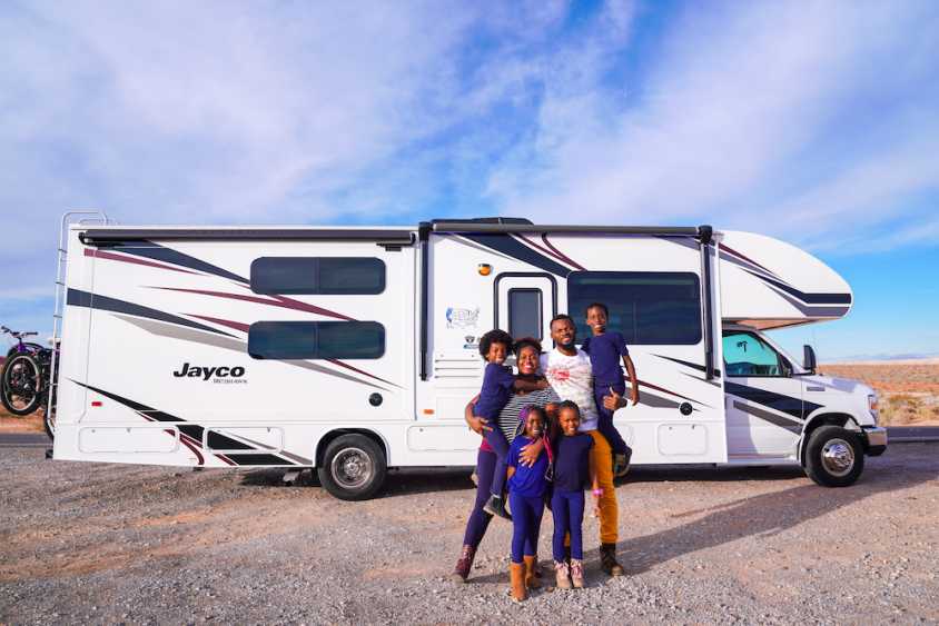Family in front of an RV